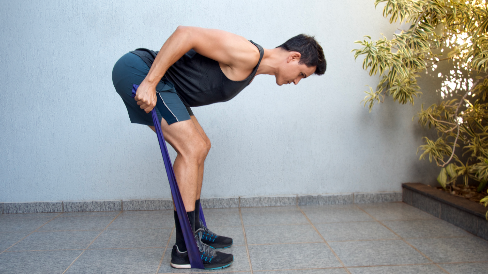 A man doing bent over banded rows