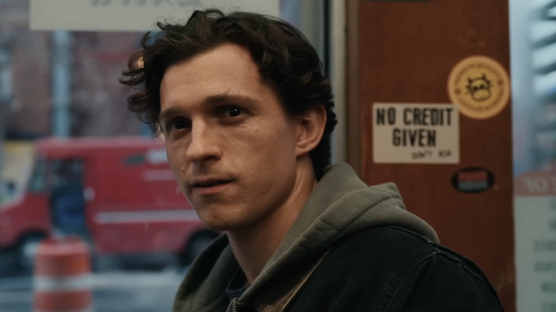 Tom Holland as Peter Parker in a cafe in Spider-Man: Brand New Day