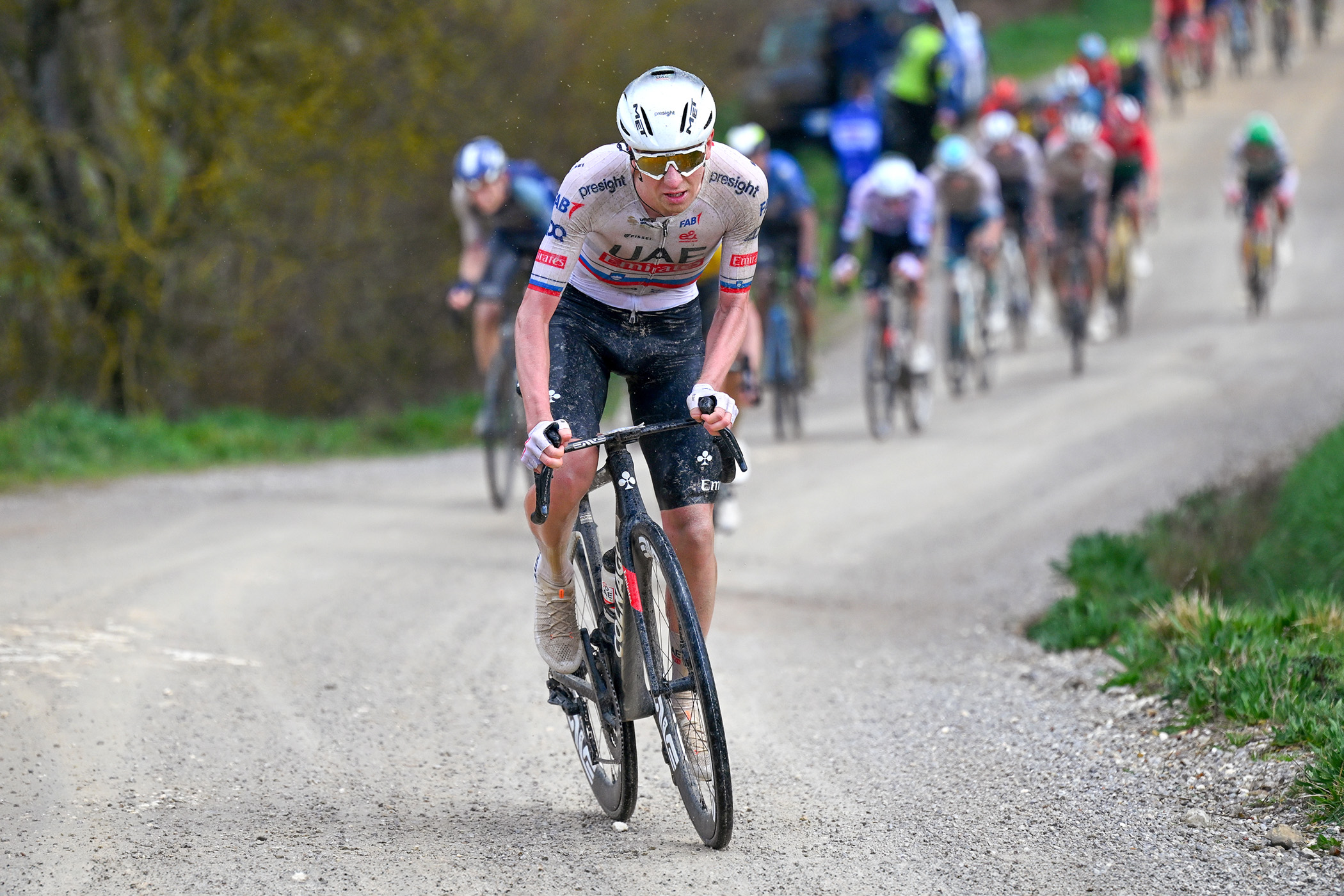 Tadej Pogačar attacks his rivals uphill on the Monte Sante Marie gravel sector at the 2024 Strade Bianche to begin his 81km solo ride to victory
