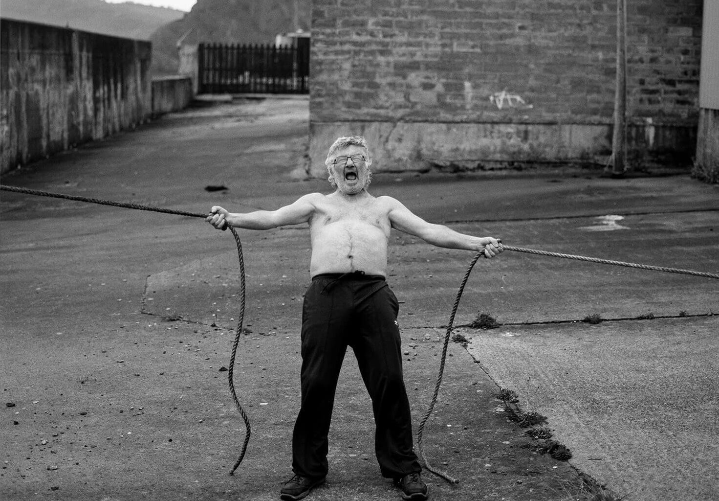 Man holding ropes aggressively