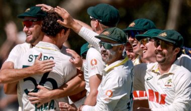 Australia congratulate Mitchell Starc after a wicket against Bangladesh on a wild first day of the second Test in Mackay
