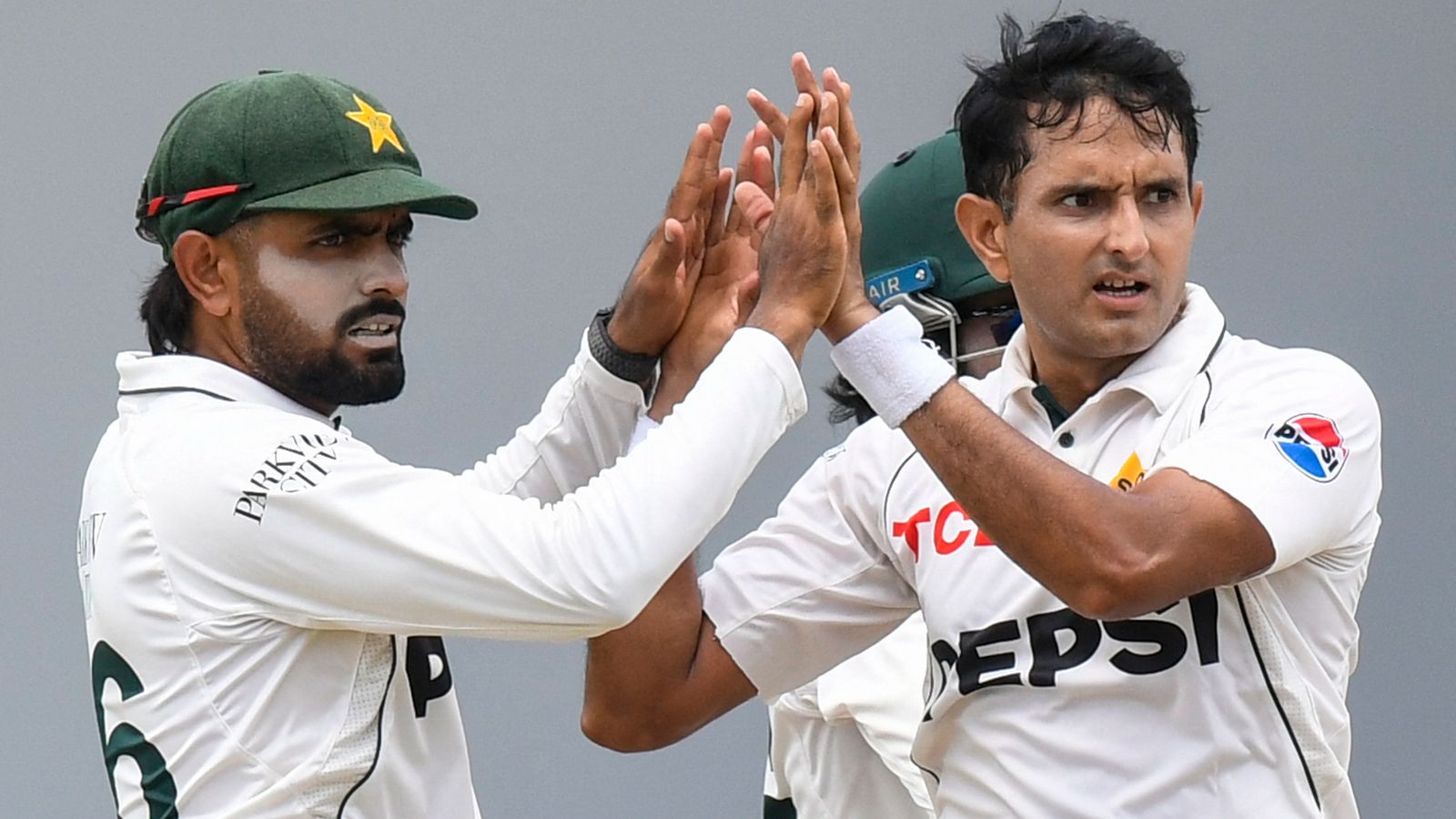 Mohammad Abbas (right) and Babar Azam of Pakistan celebrate victory over the West Indies