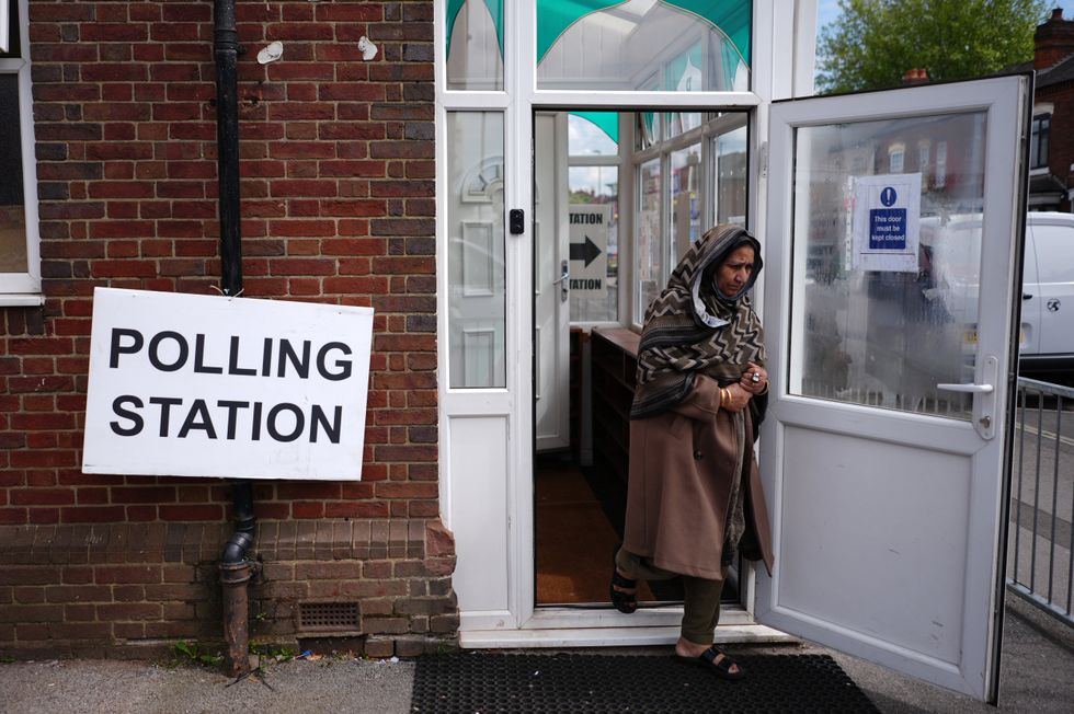 Voter leaving a poll station on Green Lane in Small Heath, Birmingham as part of the May local elections