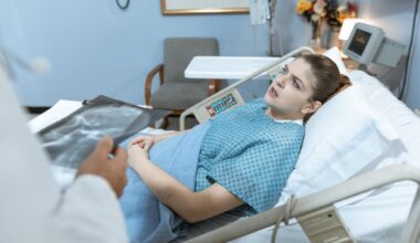 woman speaking to doctor in hospital