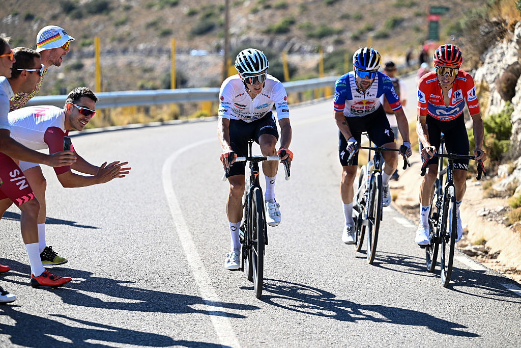 Enric Mas (right) battles with Oscar Onley (left) and Primož Roglič (middle)