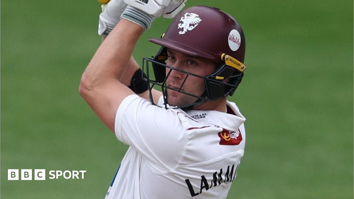 Tom Lammonby wearing a purple Somerset helmet plays a cut shot