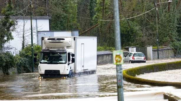 A truck stuck in water following flooding