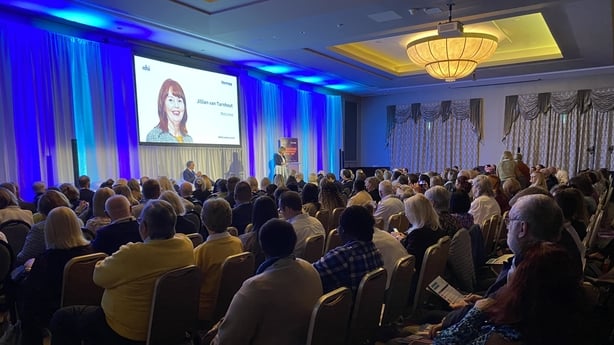 people attend a conference