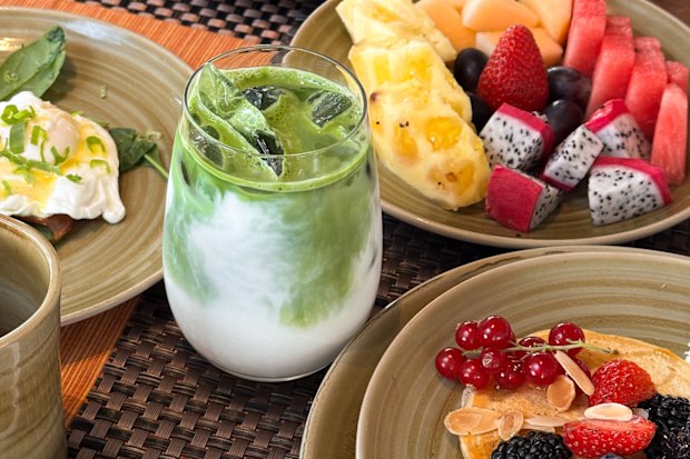 Stock image of a matcha served with brunch dishes