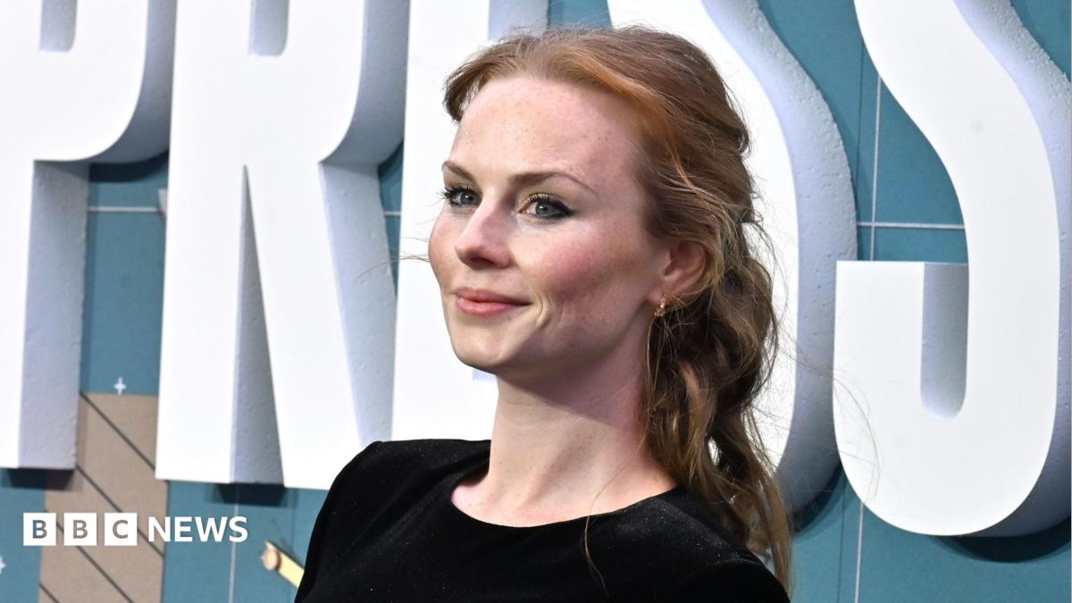 Roseanna Brown at the European premiere of Pressure at Odeon Luxe Leicester Square in London on 1 September 2026. There is a sign with the film's name behind her.