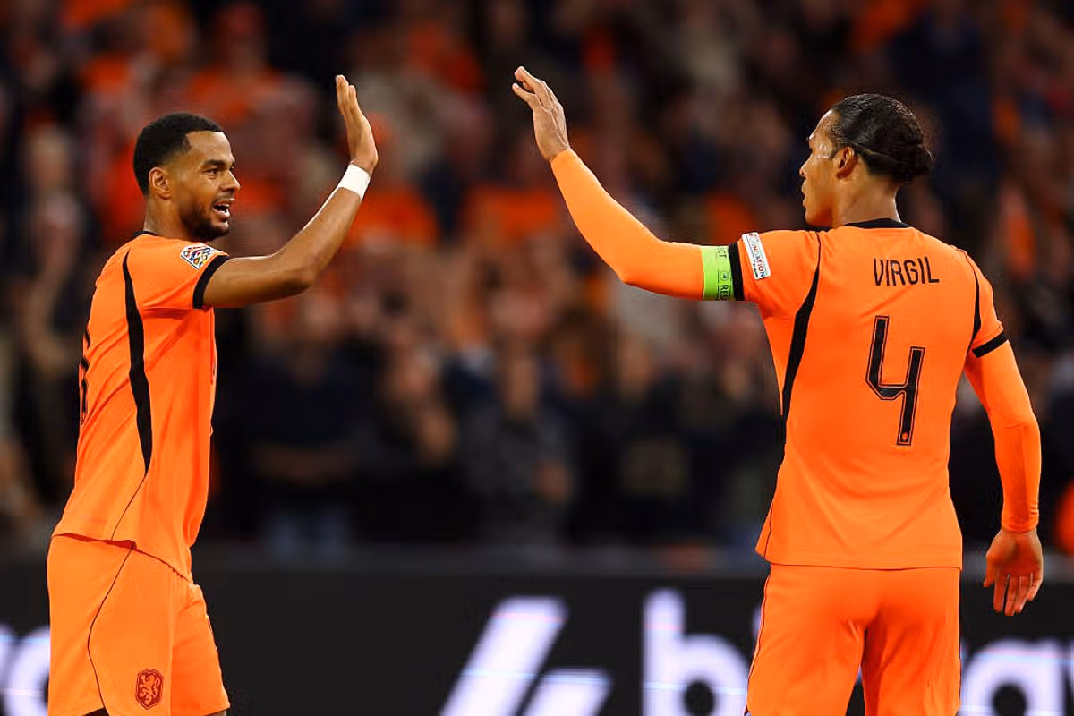 AMSTERDAM, NETHERLANDS - SEPTEMBER 24: Cody Gakpo of Netherlands celebrates scoring his teams first goal of the game with teammate Virgil van Dijk during the UEFA Nations League 2026/27 group phase match between Netherlands and Germany at on September 24, 2026 in Amsterdam, Netherlands. (Photo by Dean Mouhtaropoulos/Getty Images)