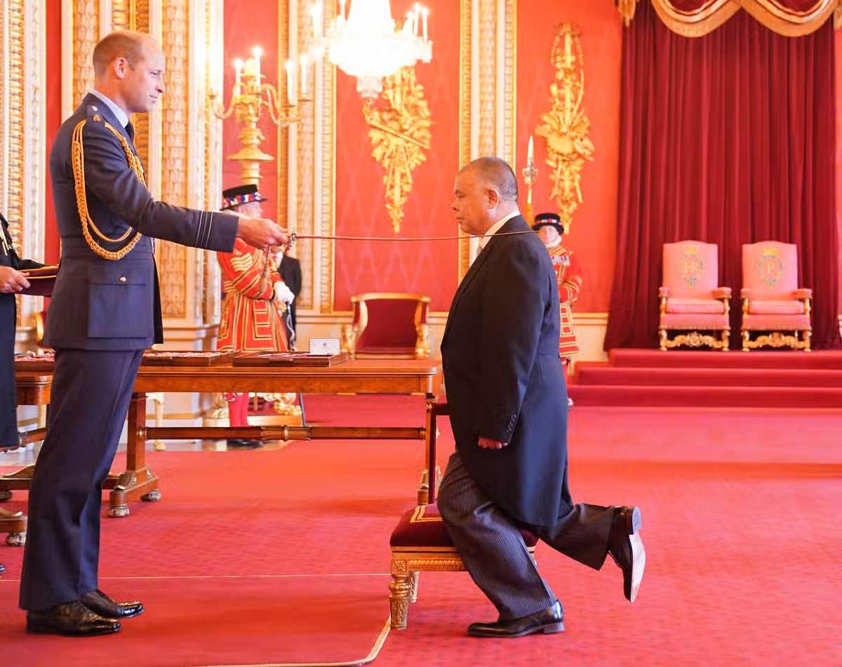 Sir Jonathan being knighted