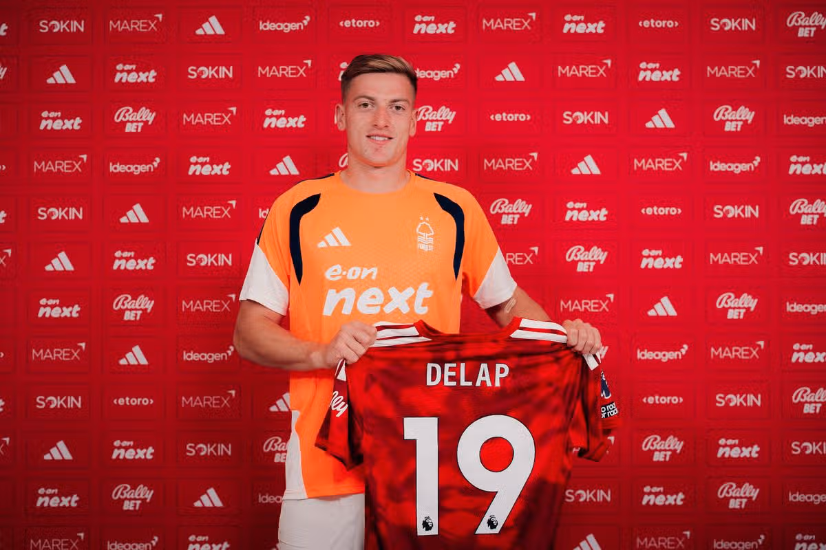 Liam Delap poses after signing for Nottingham Forest at the City Ground.