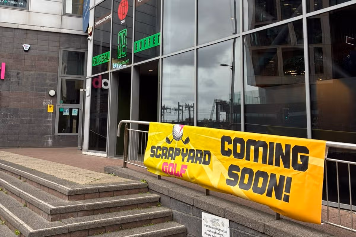 A picture of a yellow banner outside a building