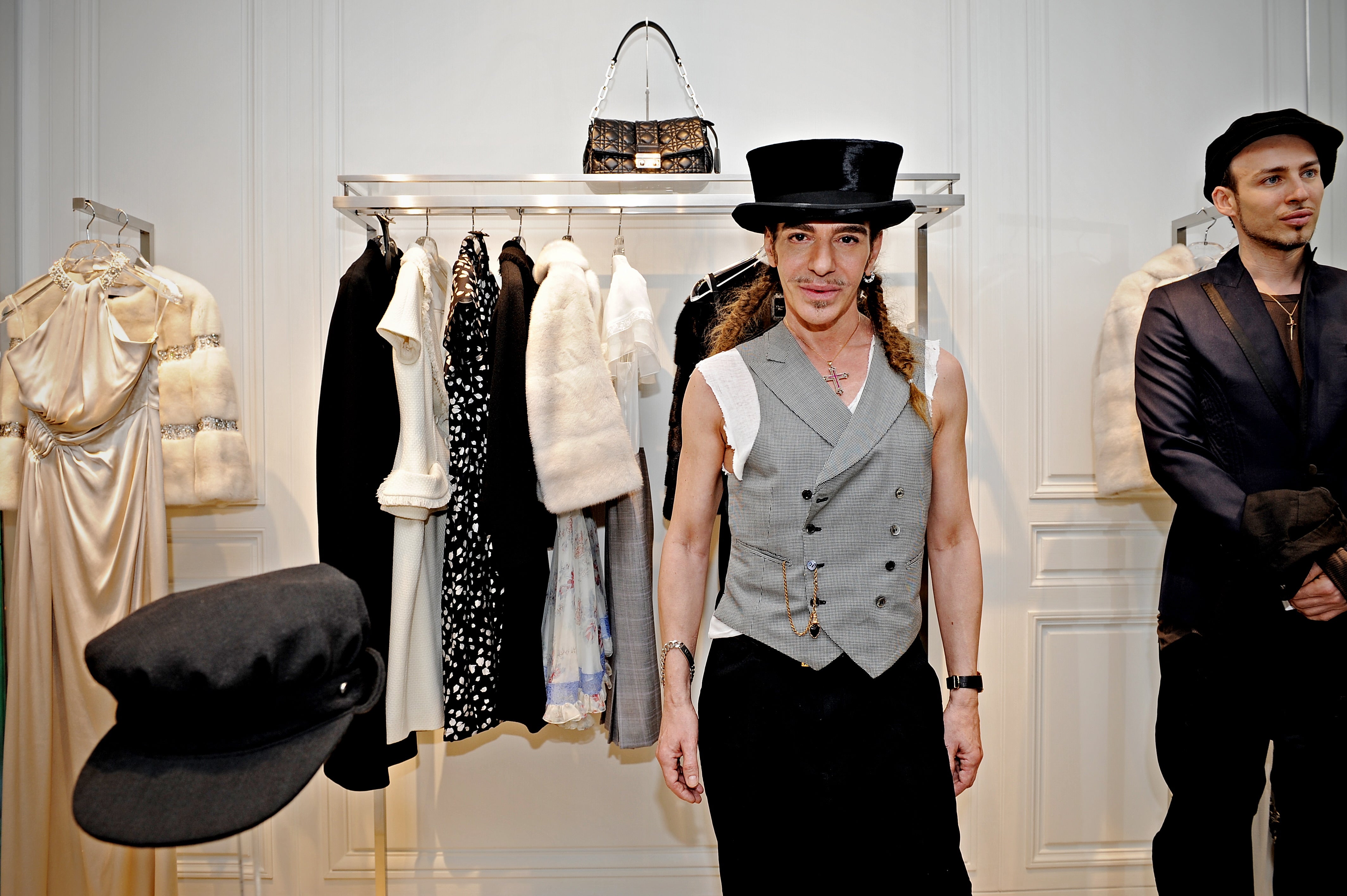 John Galliano (pictured in a Dior store in Shanghai in 2010) was briefly exiled from the fashion world after his 2011 antisemitic comments surfaced