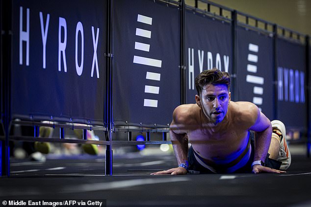 A participant competes at the burpees station during the Hyrox Men Istanbul 2026 fitness race at the Istanbul Expo Center