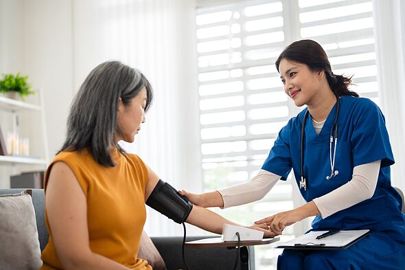 Elderly person, caregiver and test for review