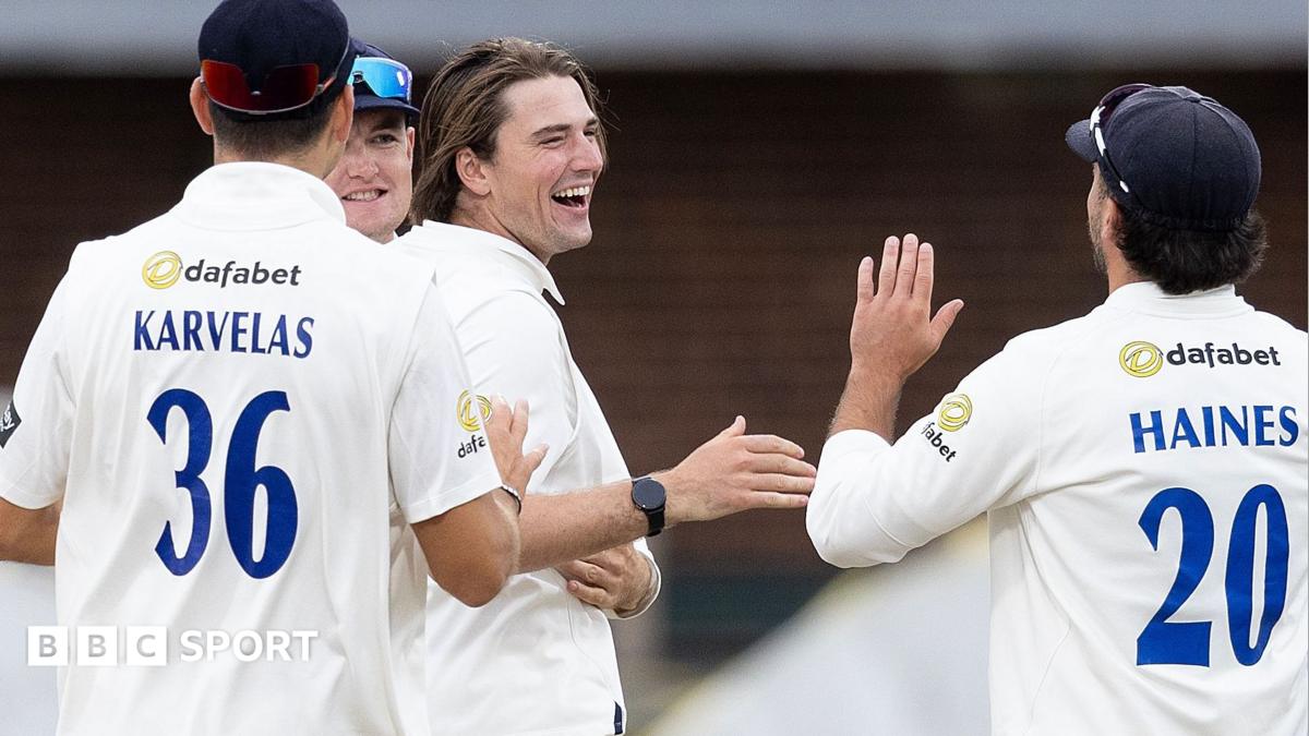Sussex players celebrate taking a wicket
