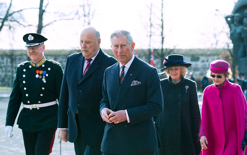 Five people walk together.
