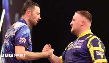 Luke Humphries (left) and Luke Littler clasp hands