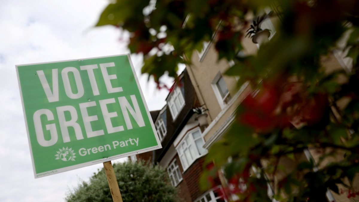 A sign supporting the Green Party political party is displayed in a residential street on the eve of local and mayoral elections in England and devolved parliamentary elections in Wales and Scotland on May 7, in London, Britain, May 6, 2026. REUTERS/Toby Melville