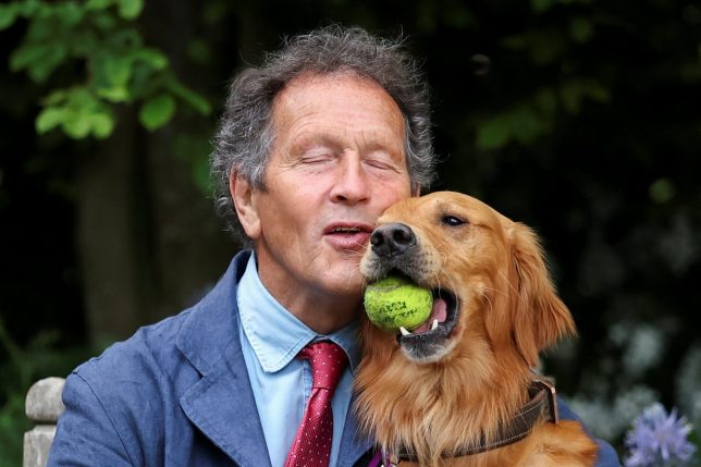 Gardening expert Monty Don, together with his dog, Ned, sits at the RHS and BBC Radio 2 Dog Garden at the Chelsea Flower Show in London, Britain, May 19, 2025. REUTERS/Toby Melville