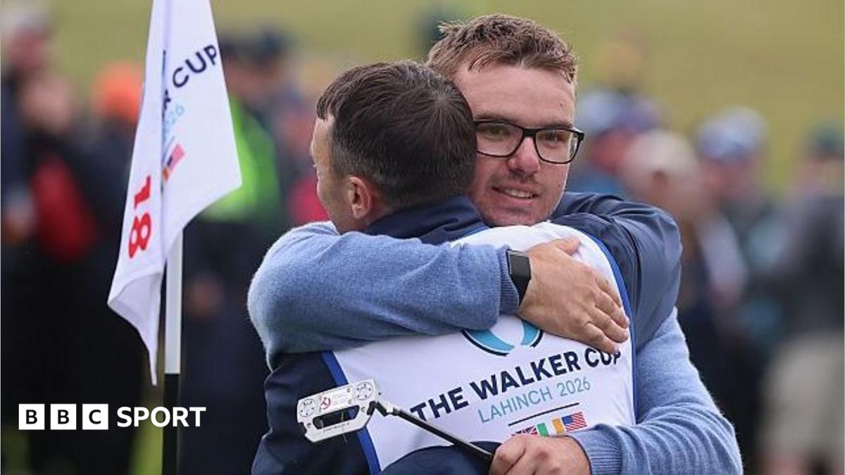 Eliot Baker hugs his caddie
