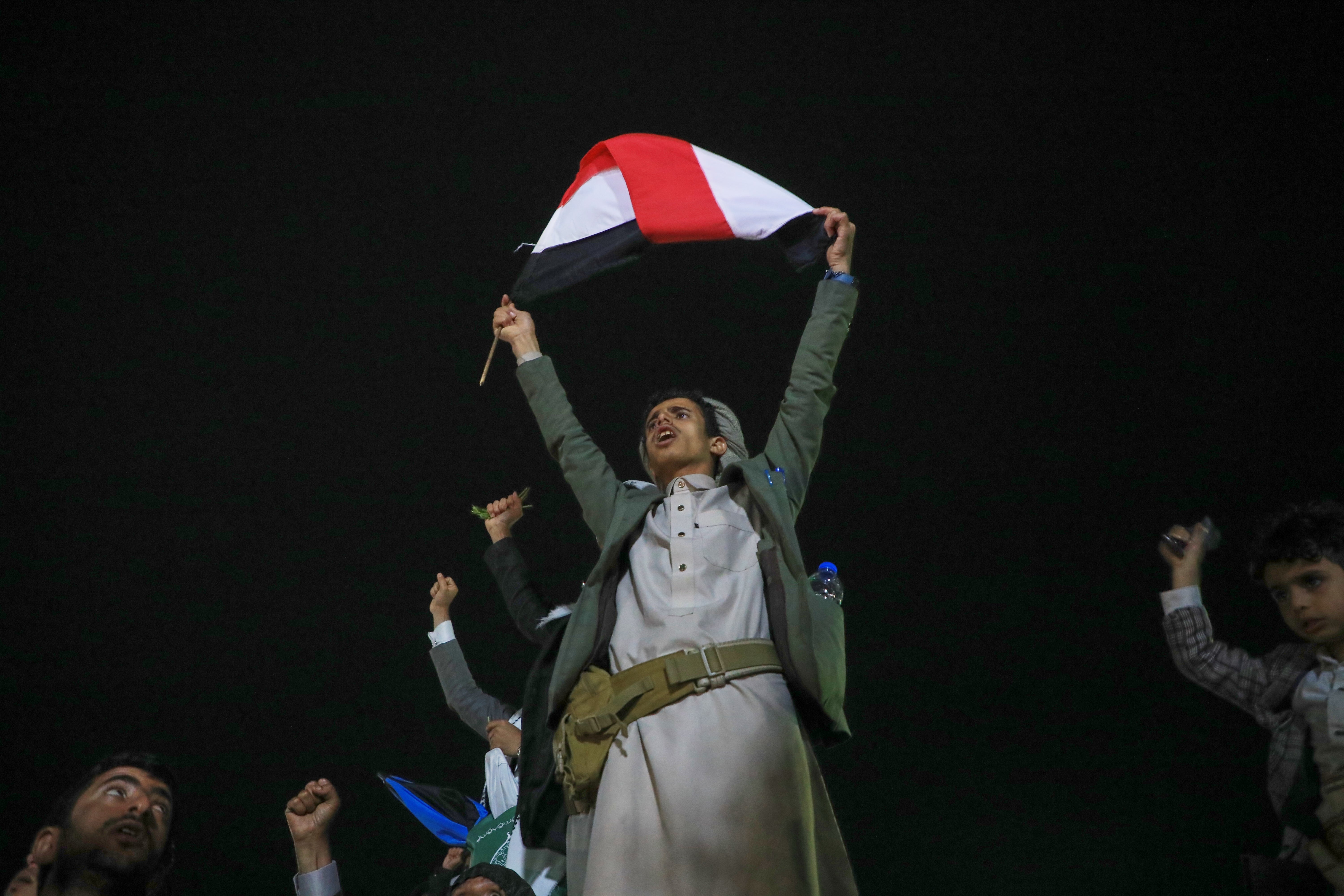 Supporters celebrate as they attend a rally organised by Houthis in Yemen to celebrate the group's capture of Mayun Island in the strategic Bab el-Mandeb Strait