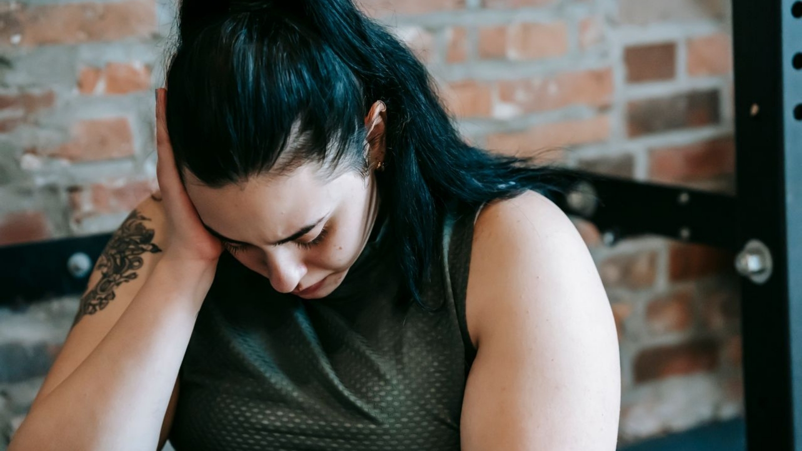 Woman looking sad at the gym