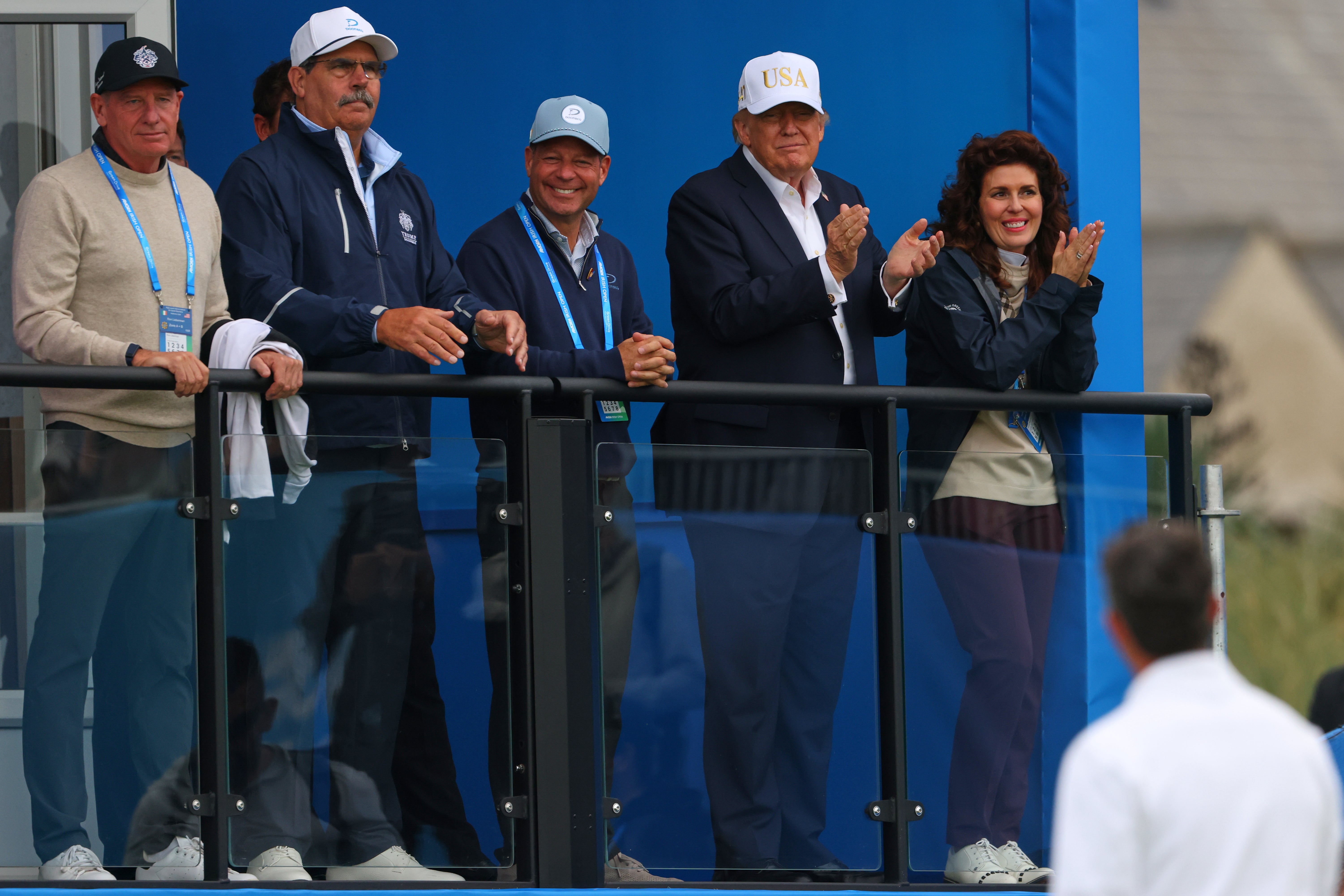U.S. President Donald Trump applauds to golfer Rory McIlroy of Northern Ireland during the Irish Open at the Trump International Golf Links course in Doonbeg, Ireland, Saturday, Sept. 12, 2026.(AP Photo/Peter Morrison)