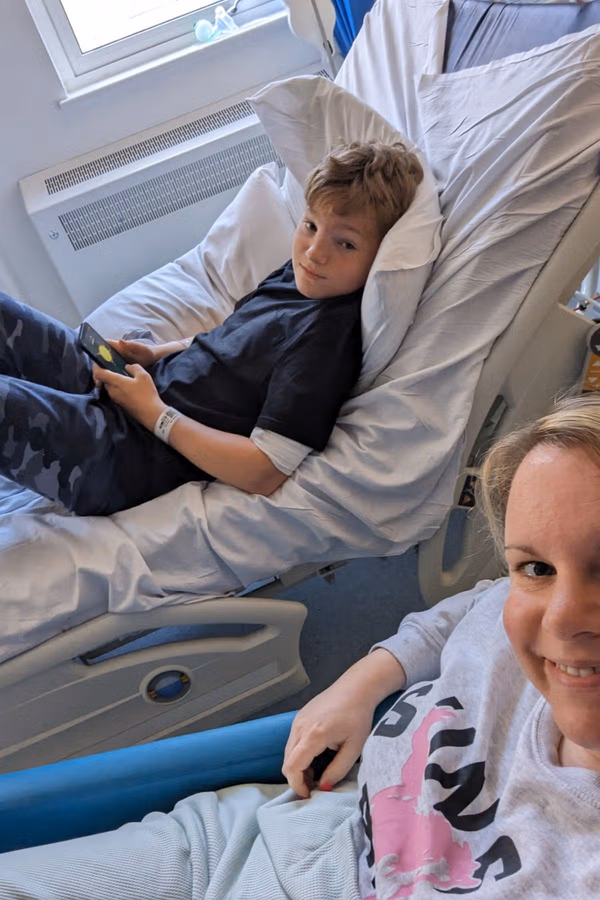 Jake in the hospital with his mother