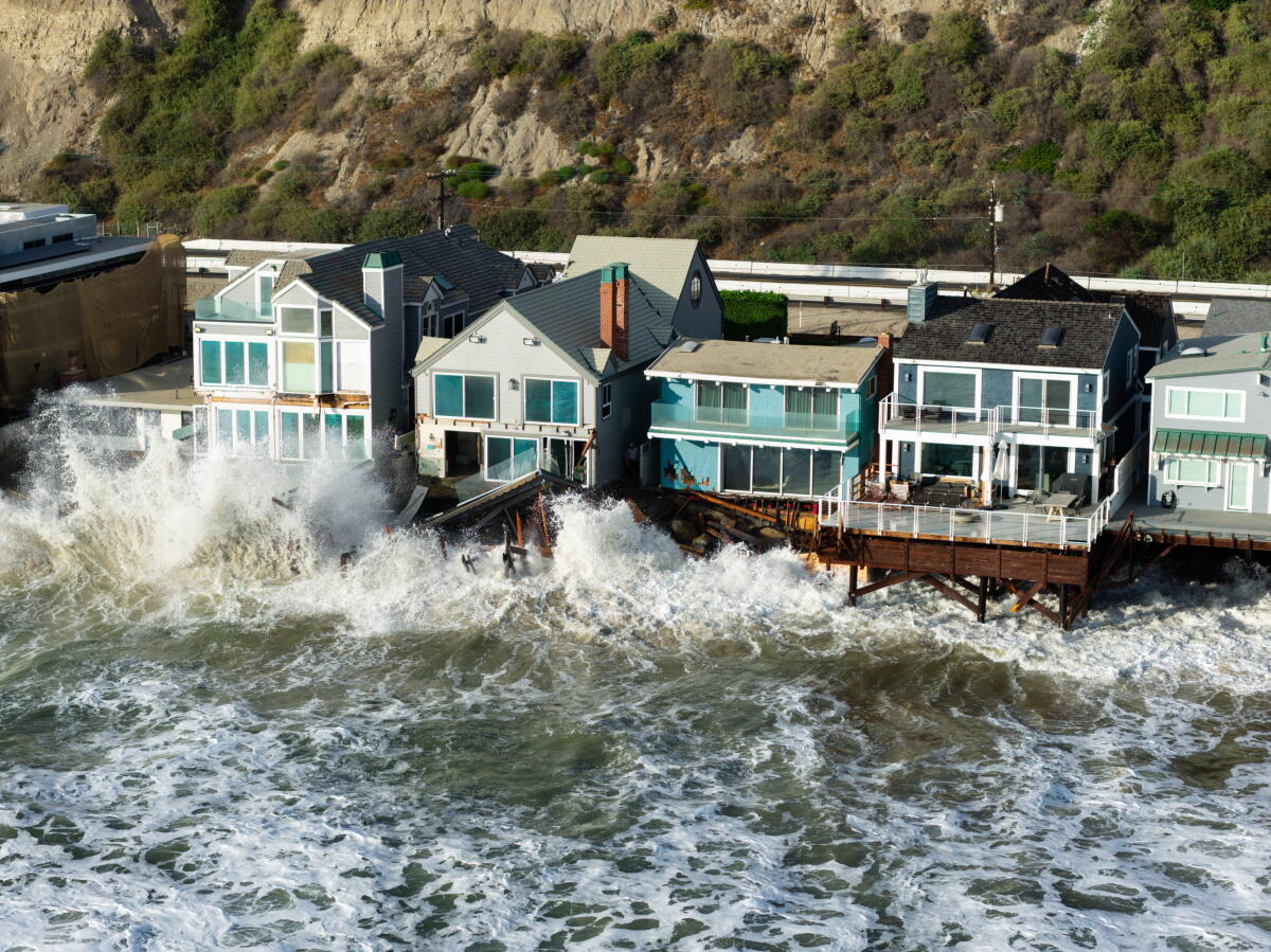 Waves inundate homes along Beach Road in Dana Point.