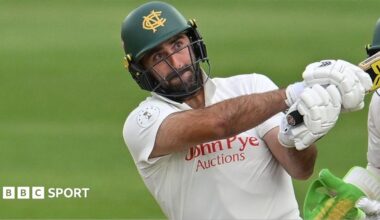 Brett Hutton, wearing a green Nottinghamshire helmet, plays a shot for Notts