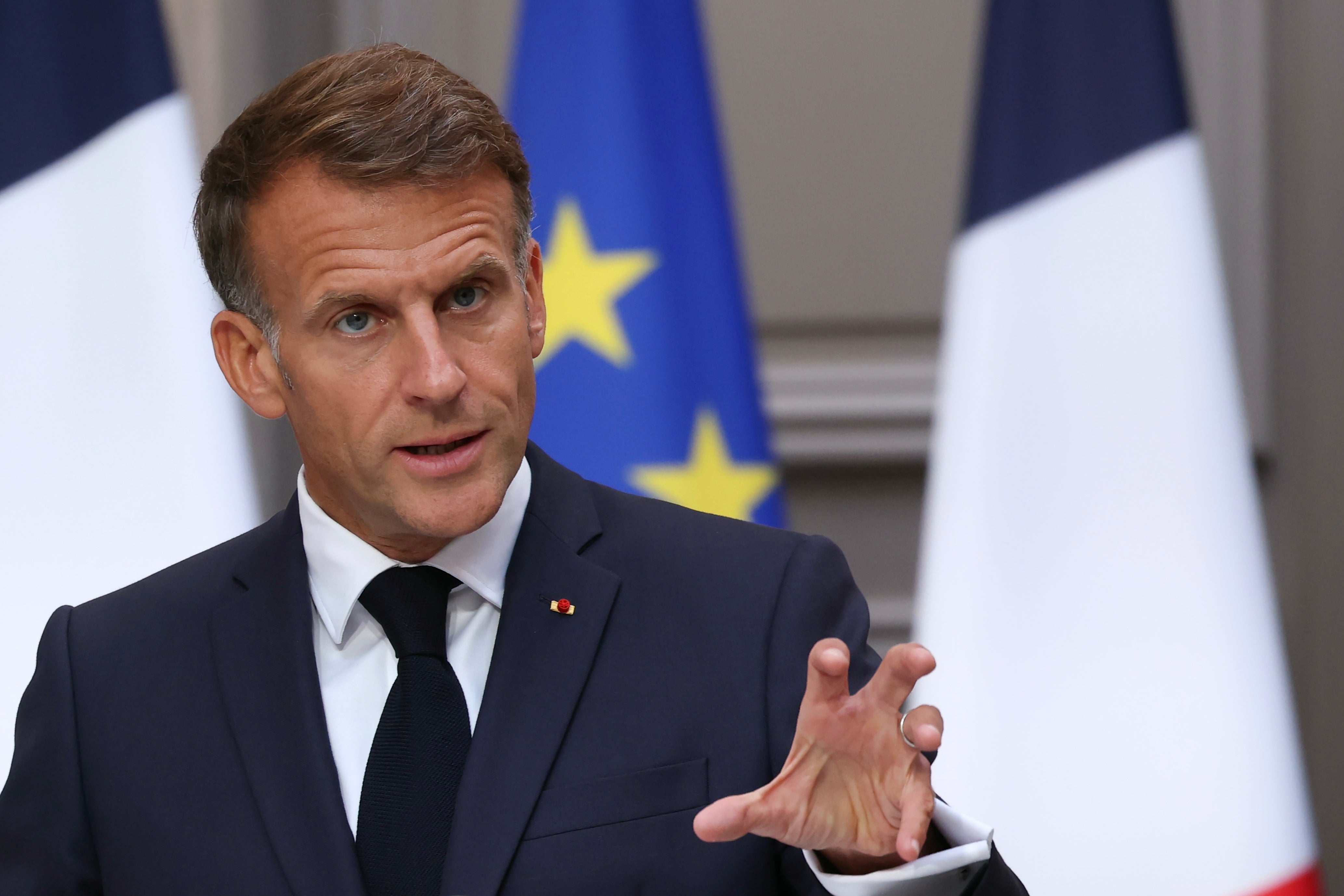 French President Emmanuel Macron gestures as he addresses the audience during a press conference following a meeting with the 2027 presidential election candidates and party leaders