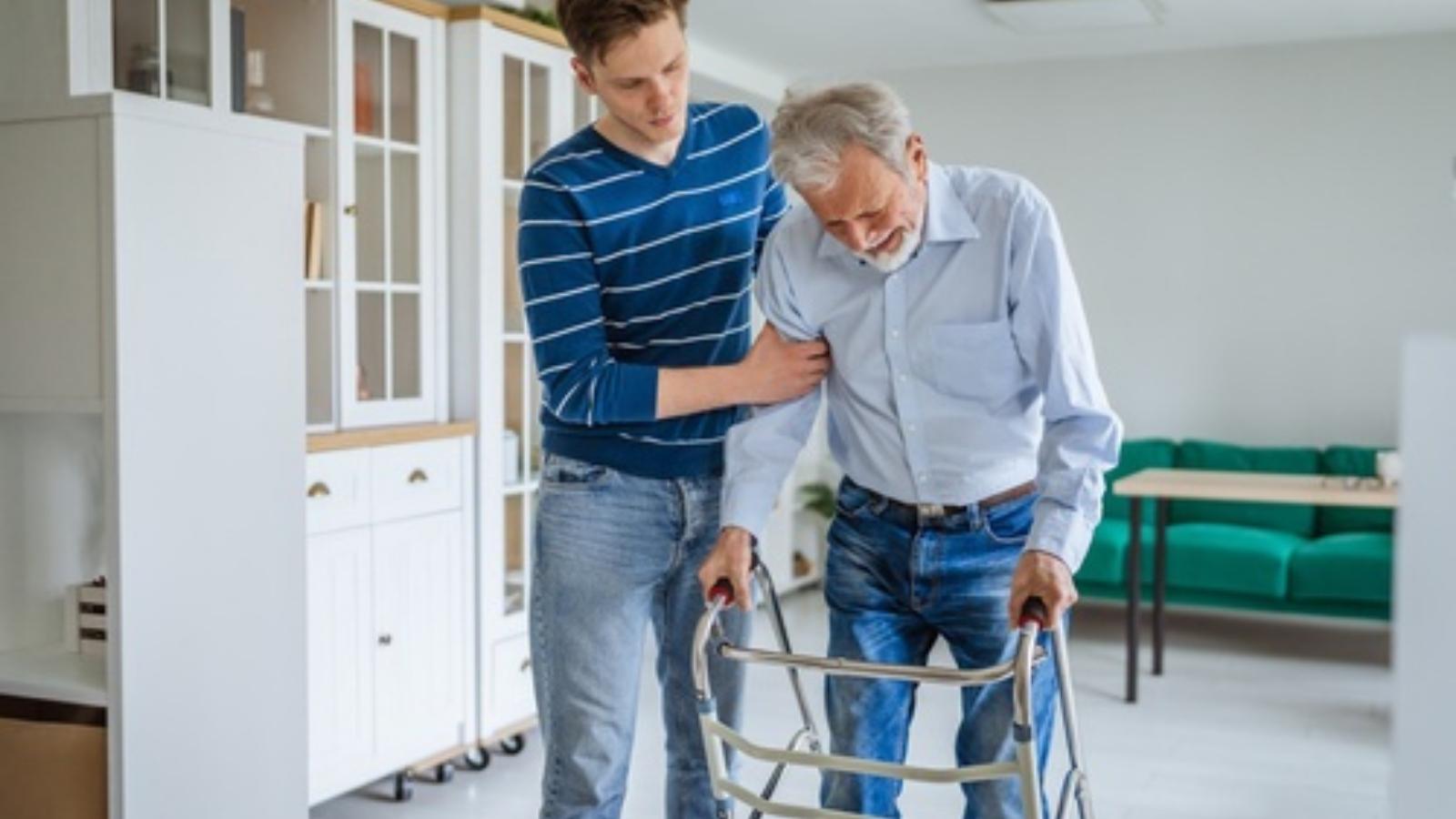 Son caring for father