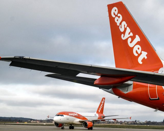 (FILES) This photograph taken on February 5, 2024 shows EasyJet planes on the tarmac of the Saint Exupery Airport in Colombier Saugnieu, southeastern France. British no-frills airline EasyJet on April 16, 2026 said it expects to post a deeper first-half loss compared with one year earlier after the Middle East war sent jet fuel prices soaring. (Photo by JEFF PACHOUD / AFP via Getty Images)