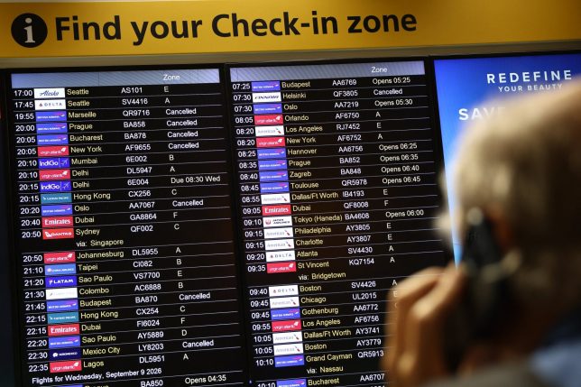 TOPSHOT - Cancelled flights are pictured on an electronic check-in display board at Terminal 3 of London Heathrow airport, west of London on September 8, 2026, following major disruption due an issue affecting the NATS air traffic control systems. Flights to and from the UK were cancelled on on September 8, due to a "technical issue" affecting UK's National Air Traffic Services (NATS), which says it is working to resolve the situation. (Photo by Henry NICHOLLS / AFP via Getty Images)