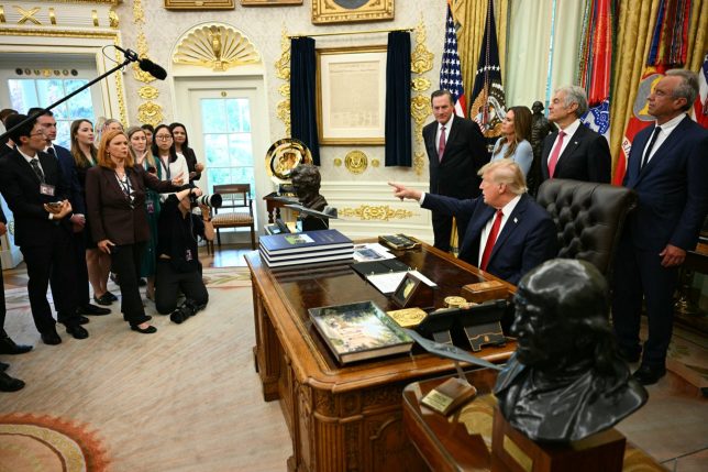 US President Donald Trump takes a question from NBC reporter Kelly O'Donnell in the Oval Office of the White House in Washington, DC, on September 18, 2026. (Photo by Jim WATSON / AFP via Getty Images)