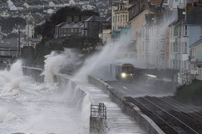 Large waves breaking over sea wall where the track was destroyed in 2014. The sea wall was rebuilt and raised up in height for extra protection after the damage occurred