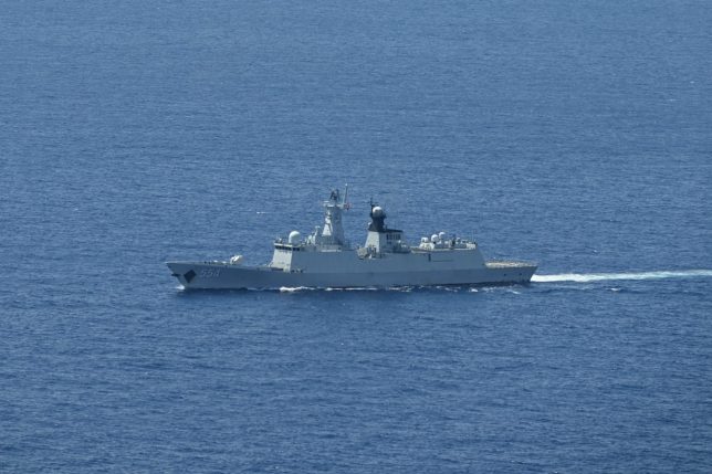 A ship identified by the Philippine Coast Guard as a Chinese Navy vessel is seen near Scarborough Shoal in the disputed South China Sea on June 15, 2026. (Photo by Jam STA ROSA / AFP via Getty Images)