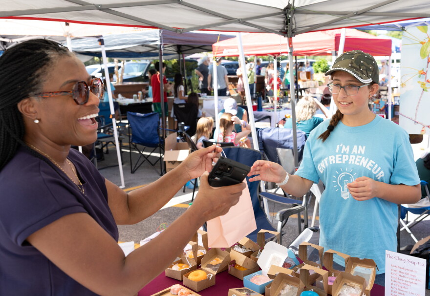 Josie Jacquay, 11, of Columbia, Ill. sells soap to Larincia Hambrick of St. Louis at Belleville Eckert’s on Sept. 12, 2026 during the Kids Markets, an international non-profit that helps children practice entrepreneurial skills.