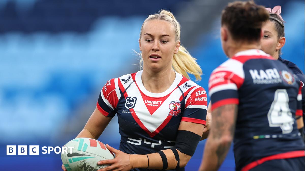 Jasmin Strange runs with a rugby ball