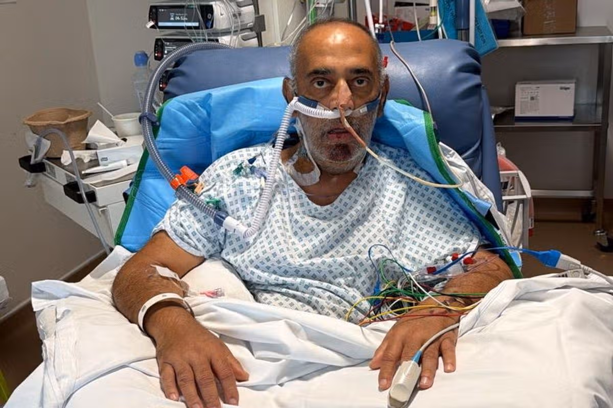 Udhyam pictured in a hospital bed 