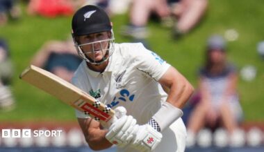 Mitchell Hay plays a shot for New Zealand.