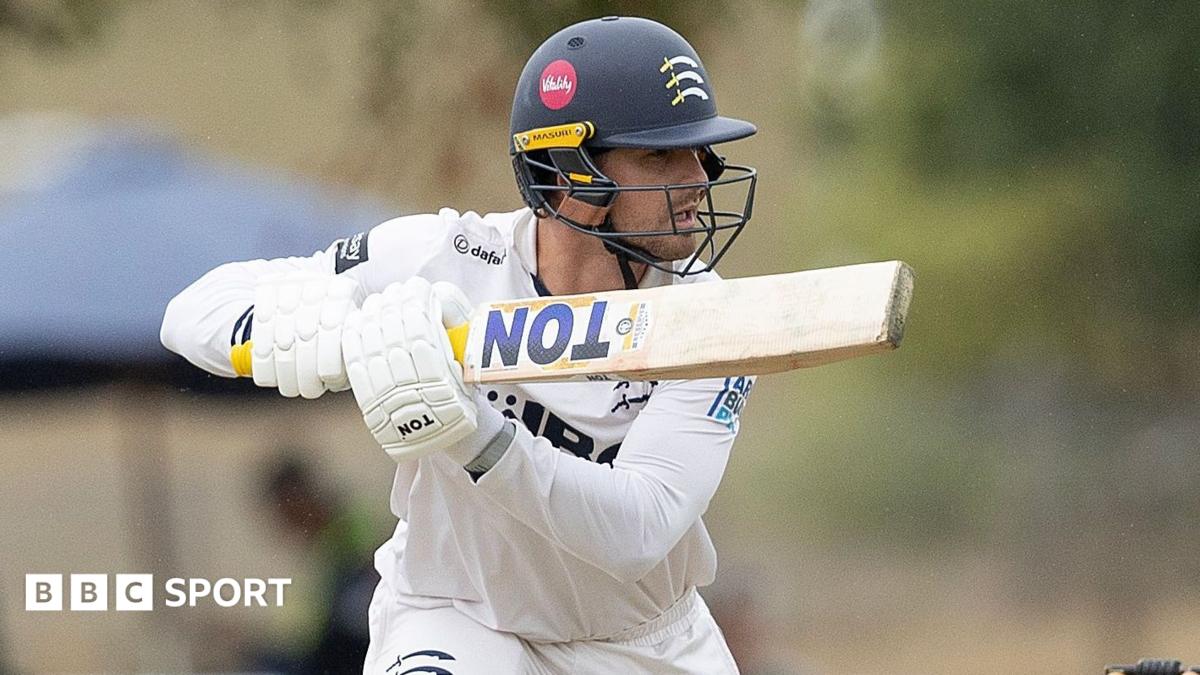 Leus du Plooy in Middlesex whites hitting a shot
