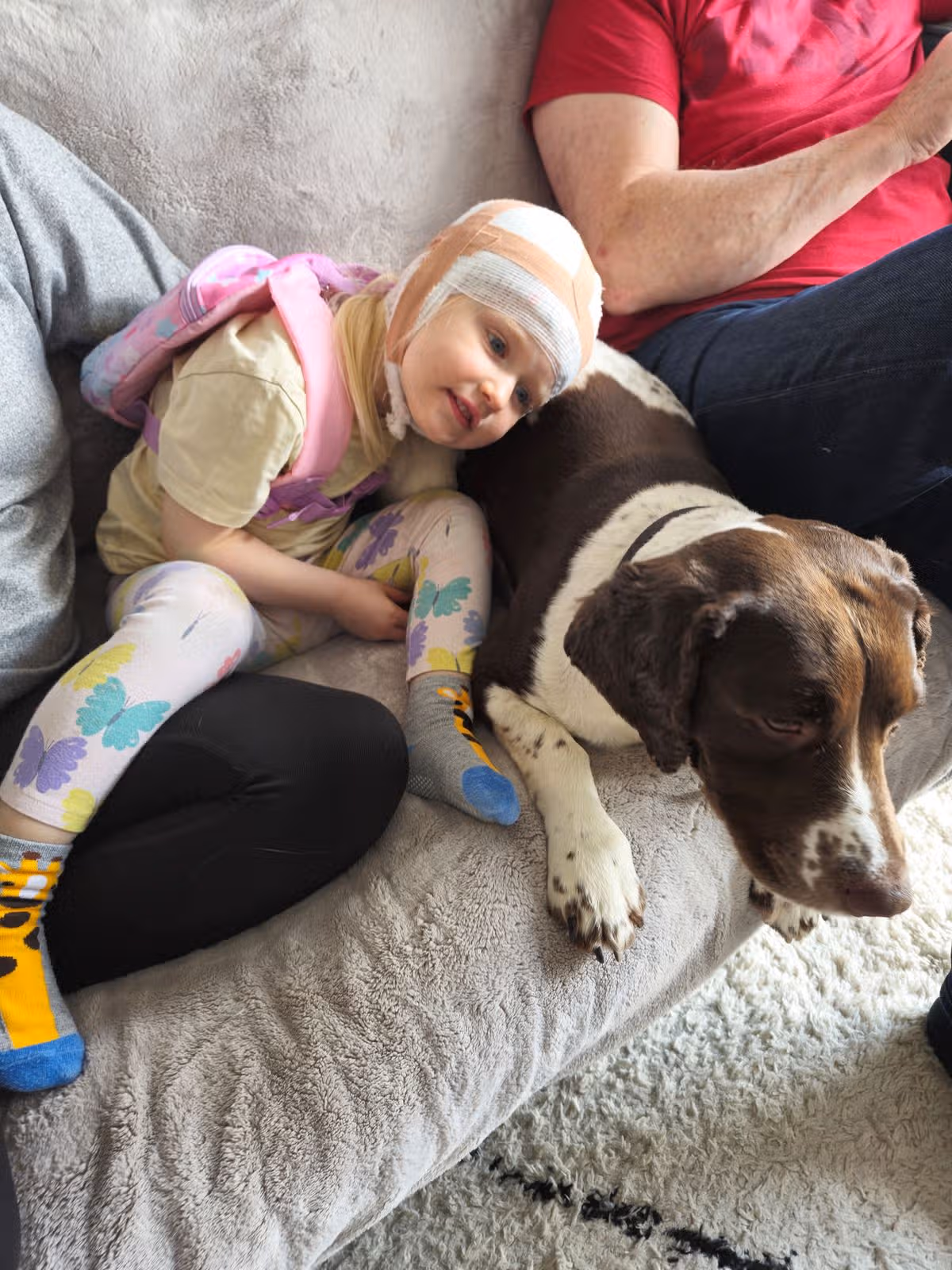 Rosie hugging a dog