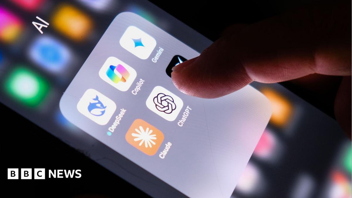 A hand on a phone displaying several AI apps including ChatGPT, Claude, Copilot, DeepSeek and Gemini
