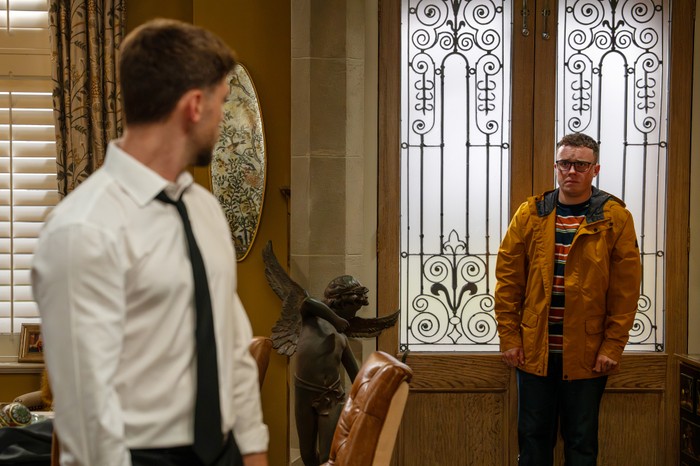 Vinny and Joe in the Home Farm hallway in a scene from Emmerdale
