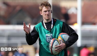 Rhys Patchell holds rugby balls under his left arm while coaching Dragons in a warm-up
