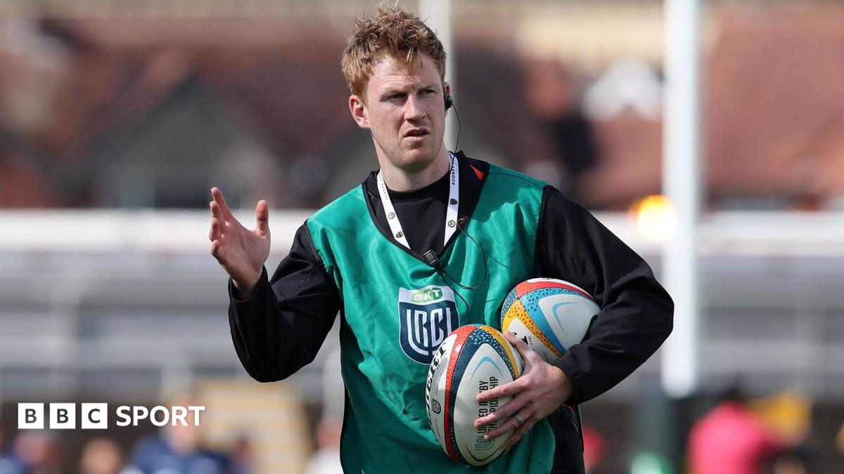 Rhys Patchell holds rugby balls under his left arm while coaching Dragons in a warm-up